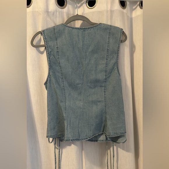 Jean vest with lace up sides and button up front. - Picture 2 of 3